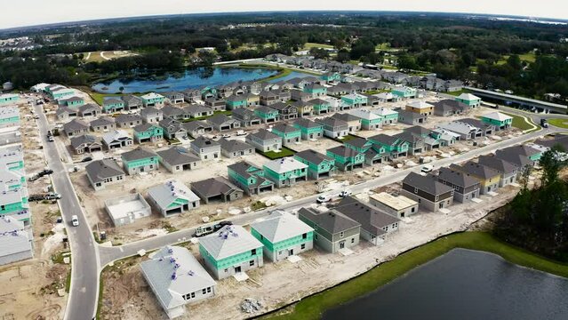 Drone video of construction progress on a residential subdivision in Central Florida, drone orbit right to left
