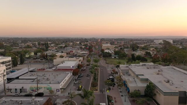 Drone flying backwards over street in Chula Vista, California.