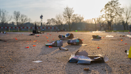 Garbage and waste of New Year´s fireworks in overfowing stuffed trash can on New Year´s day