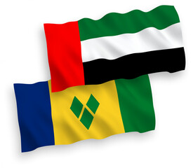 National vector fabric wave flags of Saint Vincent and the Grenadines and United Arab Emirates isolated on white background. 1 to 2 proportion.