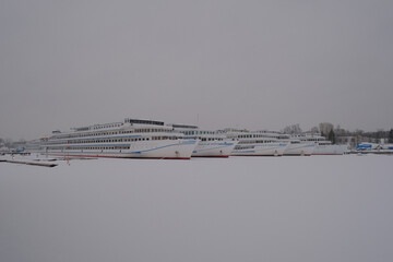 Four large ships, motor ships, are in winter parking in the ice.