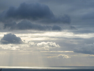 Fototapeta na wymiar Long aerial view of evening clouds over Tasman sea coast