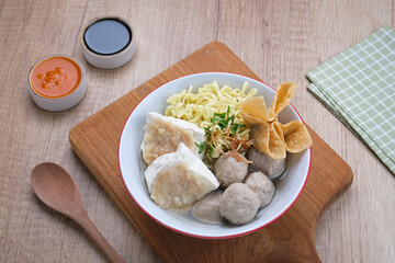 Bakwan Malang or Bakso Malang, traditional food from Malang, East Java, Indonesia. Meatballs soup served with noodles, tofu and fried dumpling (pangsit)

