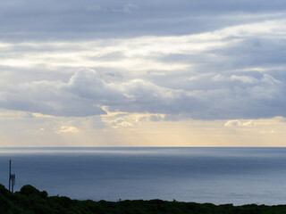 Fototapeta premium Low evening clouds over Tasman sea coast