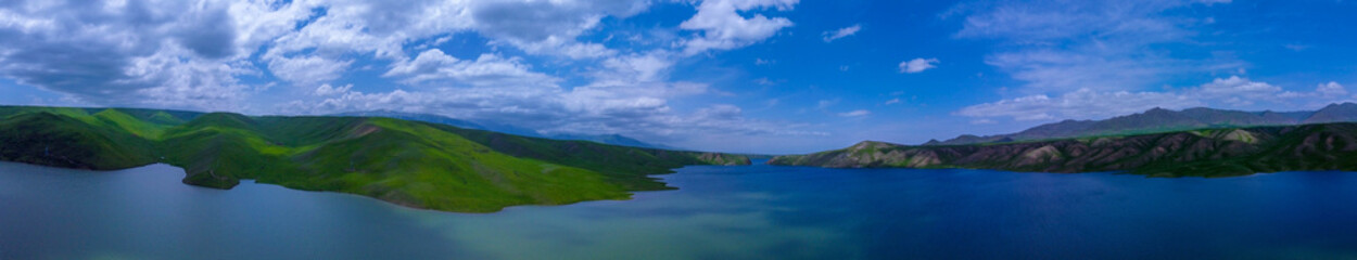 Naklejka na ściany i meble Панорама, вид на озеро с высоты, облака. Panorama, view of the lake from a height, clouds