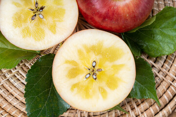 Sweet honey core apple fruit on wooden background, Honey apple on wooden mat over wooden background...