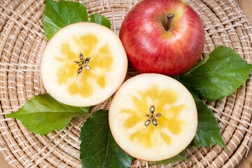 Sweet honey core apple fruit on wooden background, Honey apple on wooden mat over wooden background...