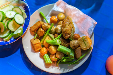 close-up Vietnamese food. Delicious homemade fried fish balls on table. popular street food of vietnam. Selective focus