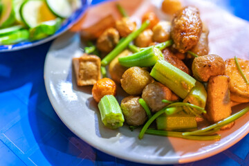 close-up Vietnamese food. Delicious homemade fried fish balls on table. popular street food of vietnam. Selective focus