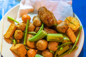 close-up Vietnamese food. Delicious homemade fried fish balls on table. popular street food of vietnam. Selective focus