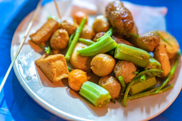 close-up Vietnamese food. Delicious homemade fried fish balls on table. popular street food of vietnam. Selective focus