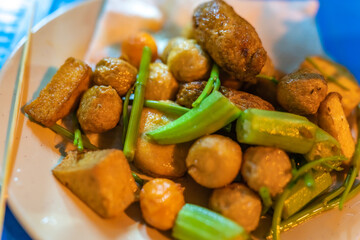 close-up Vietnamese food. Delicious homemade fried fish balls on table. popular street food of vietnam. Selective focus