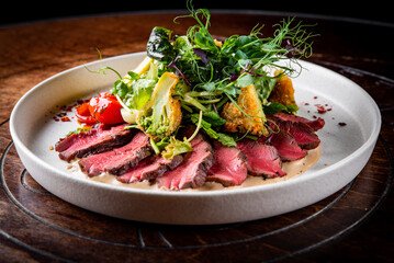 Roastbeef salad with vegetables on plate