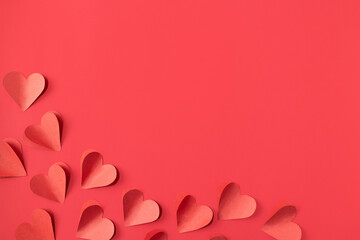Valentine's day background with red and pink hearts like balloons on red background, flat lay