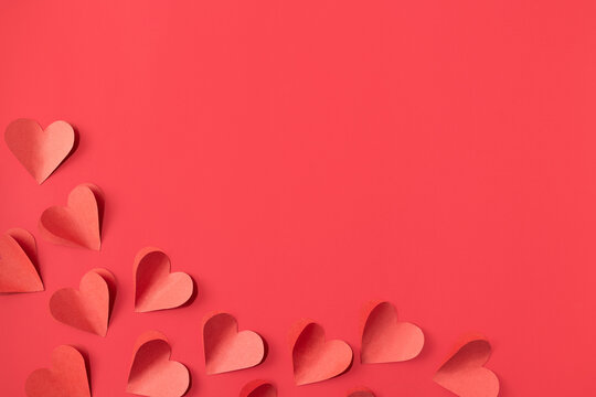Valentine's day background with red and pink hearts like balloons on red background, flat lay - Powered by Adobe