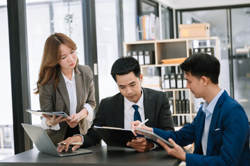  Young business creative team are brainstorming planning discussing while sitting in creative business discussing work in office..