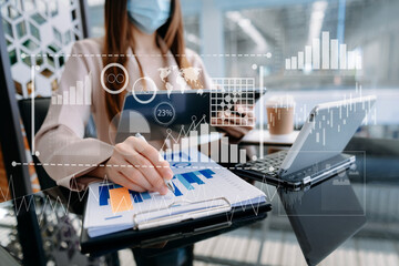 Team colleagues wear formal attire to work together to optimize business processes by using new technologies. high tech hologram in office background.