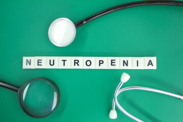 stethoscope and alphabet letters with the word Neutropenia. concept of illness and hospitality