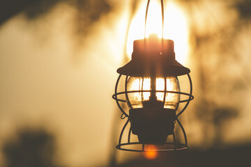 Vintage lantern  in the morning, sunrise time.