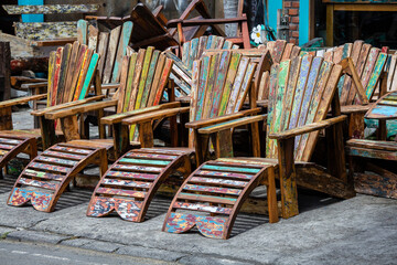 Obraz premium Old vintage colorful chairs in Ubud street market, island Bali, Indonesia . Closeup