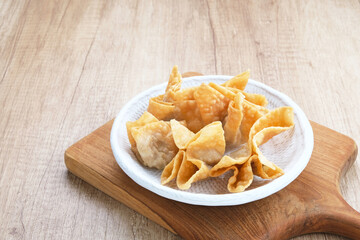 Pangsit Goreng (Chicken Fried Dumpling), Indonesian Traditional Food. Served with sauce
