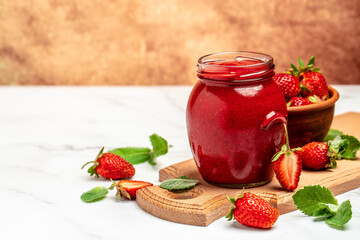 strawberry jam in a jar and fresh berries on the wooden board. banner, menu, recipe place for text