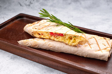 Baked pita bread with suluguni cheese and vegetables