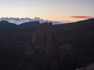 Red sunset light at Roques de Garcia with La Catedral volcanic rock formation at El Teide national park, Tenerife Canary islands, Spain.