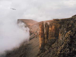 Soft focus. Bermamyt plateau. Foggy mountain view from cliff at