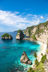 The beautiful sandy beach (Diamond beach) with rocky mountains and clear water in Nusa Penida, Bali, Indonesia