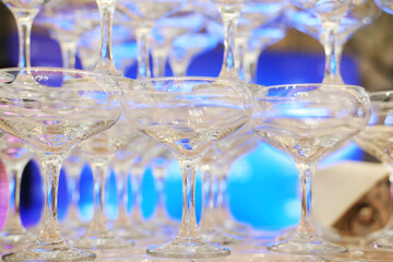 Empty champagne glasses tower design for drink in wedding party event or beverage design for reception celebration. Close up