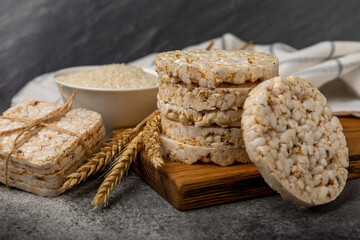 puffed rice bread on black texture background. Healthy crunchy snack. Whole grain crispy bread. Healthy food. Diet. Copy space. Place for text.