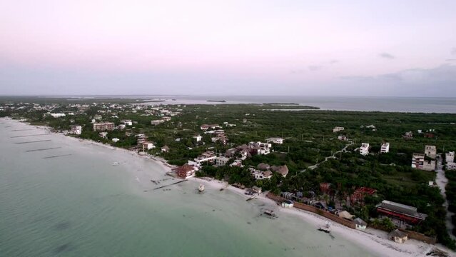 Drone tilt shot of housing on the beach. sea and ocean stock videos.
