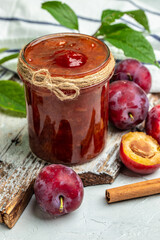 Sweet homemade plum jam on a light background. place for text, top view