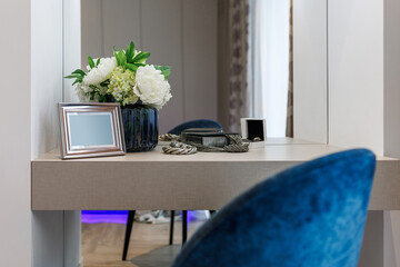 Stylish bedroom interior with an elegant toilet table and access to the balcony