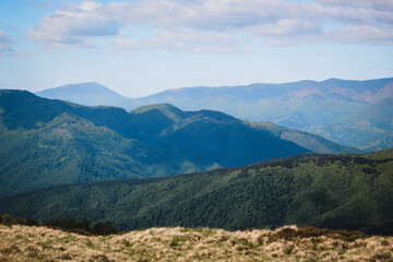 Hiking in the Carpathian Mountains. Sunny summer day. Mountain panoramas.