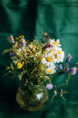 Bouquet of wildflowers in vase. Camomile flowers
