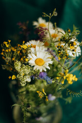 Wild flowers bouquet. Camomile bouquet in vase