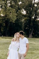 young happy couple running hand in hand in the countryside. young family concept. copy space