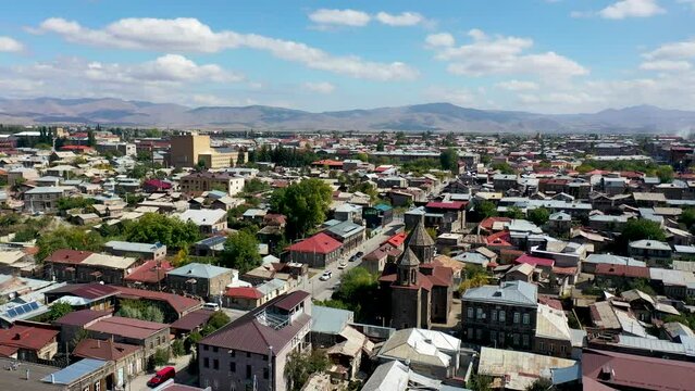 Aerial footage Gyumri city in Armenia, Caucasus. Gyumri city center, view from a quadcopter. Drone fly around church. Second largest film in Armenia. 