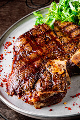 Porterhouse beef steak cooked on a grill on plate