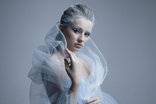 close up portrait of a beautiful snow queen, fantasy winter make up