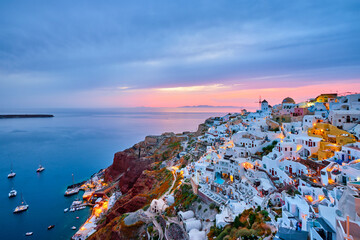 Famous greek iconic selfie spot tourist destination Oia village with traditional white houses and...