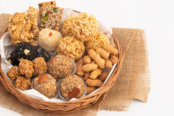 Gulab Gajak Mithai, Pista Gazak, Til Patti Or Papdi, Til Laddu Or Ladoo, Revdi And Rewri Made Of Tilgul, Mungfali, Sesame Seed, Jaggery Gud, Badam And Pista For Makar Sankranti Or Lohri Celebration