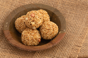 Indian Winter Delicacy White Ball Shaped Tilgul Laddu Or Safed Til Ki Laddo Is Made Of Roasted Sesame Seed, Jaggery, Gur, Peanut, Gud, Mungfali Is Enjoyed In Winter On Makar Sankranti and Lohri