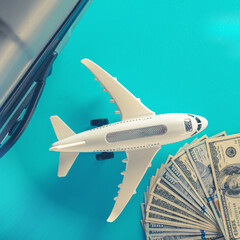 Air plane model and travel and accessories on blue background