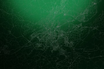 Street map of Lubeck (Germany) engraved on green metal background. Light is coming from top. 3d render, illustration