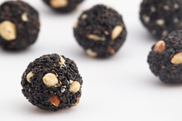 Indian Winter Delicacy Black Ball Shaped Kaala Tilgul Laddu Or Kale Til Ki Laddo Is Made Of Roasted Sesame Seed, Jaggery, Gur, Peanut, Gud, Mungfali Is Enjoyed In Winter On Makar Sankranti and Lohri