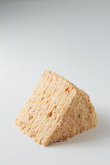 Piece Of Layered Homemade Honey Cake on the white table