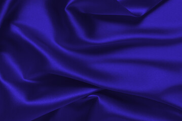 Rich and luxury red silk fabric texture background.